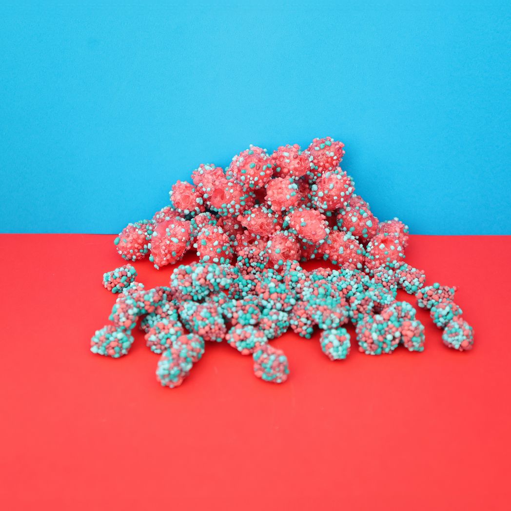 Pink and blue decorative items on a red and blue background